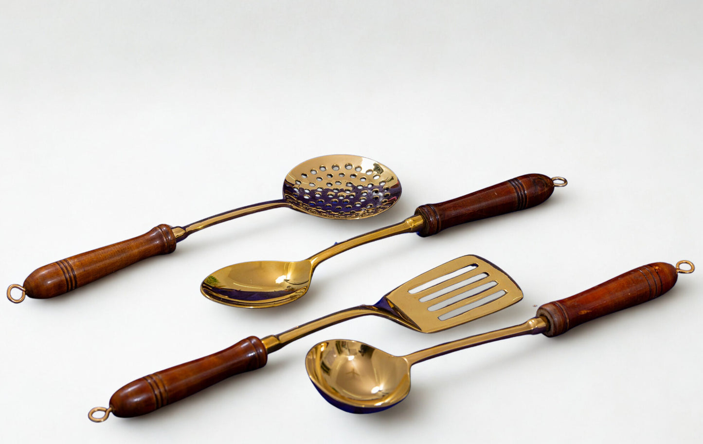 brass ladles set for cooking and serving in traditional kitchens  
