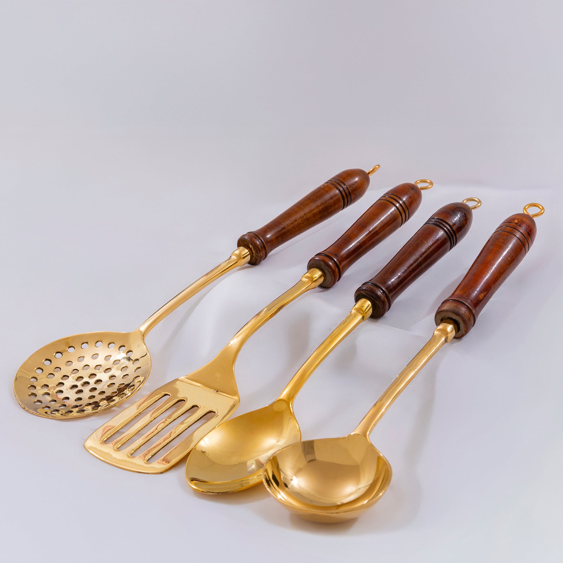 brass ladles set for cooking and serving in traditional kitchens  